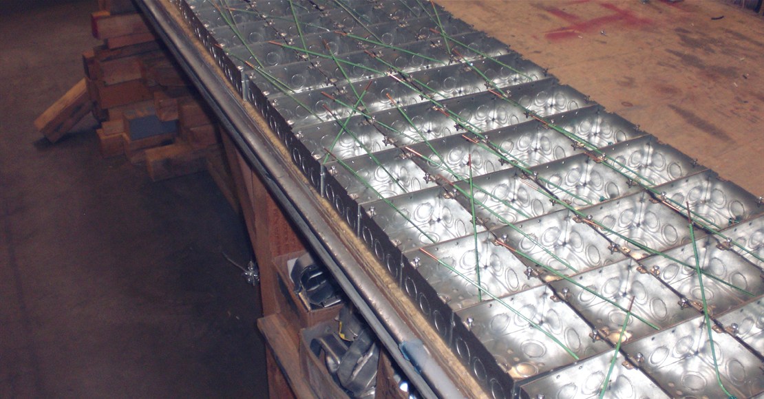 Prefab electrical assemblies arranged on a workbench